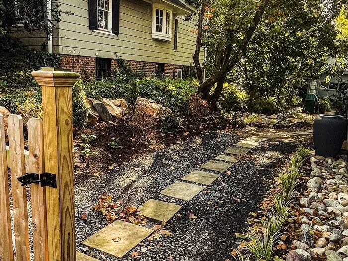 Residential drainage with subsurface drainage renovation, rain garden basin creation, native landscape design and install and boulder wall addition project in Lansdowne, PA