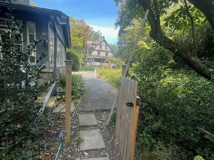 Residential drainage with subsurface drainage renovation, rain garden basin creation, native landscape design and install and boulder wall addition project in Lansdowne, PA
