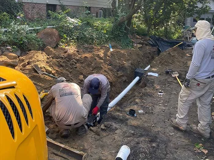 Residential drainage with subsurface drainage renovation, rain garden basin creation, native landscape design and install and boulder wall addition project in Lansdowne, PA